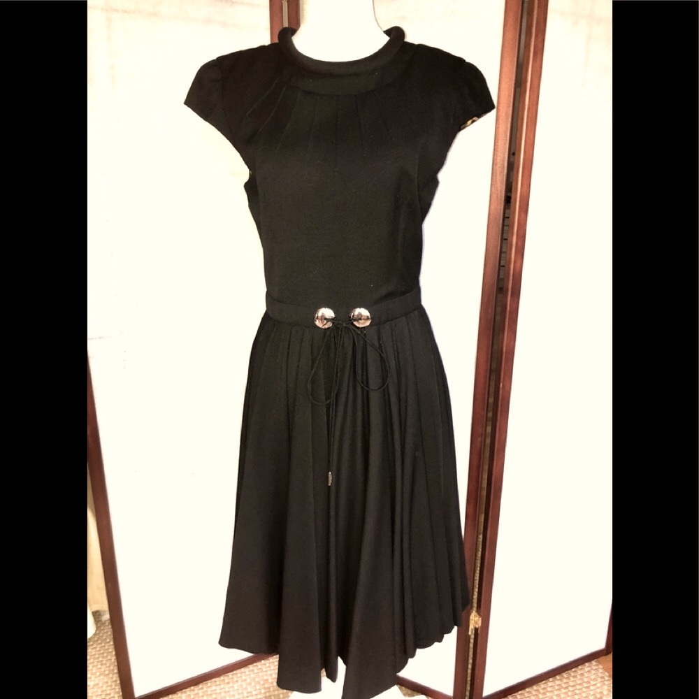 Dolce and Gabbanna black cocktail dress with flared bottom.